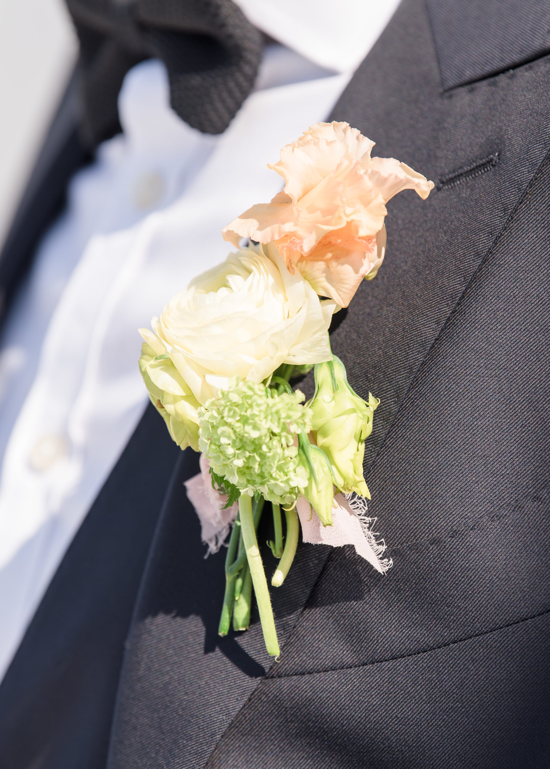 wedding bouquet on groom