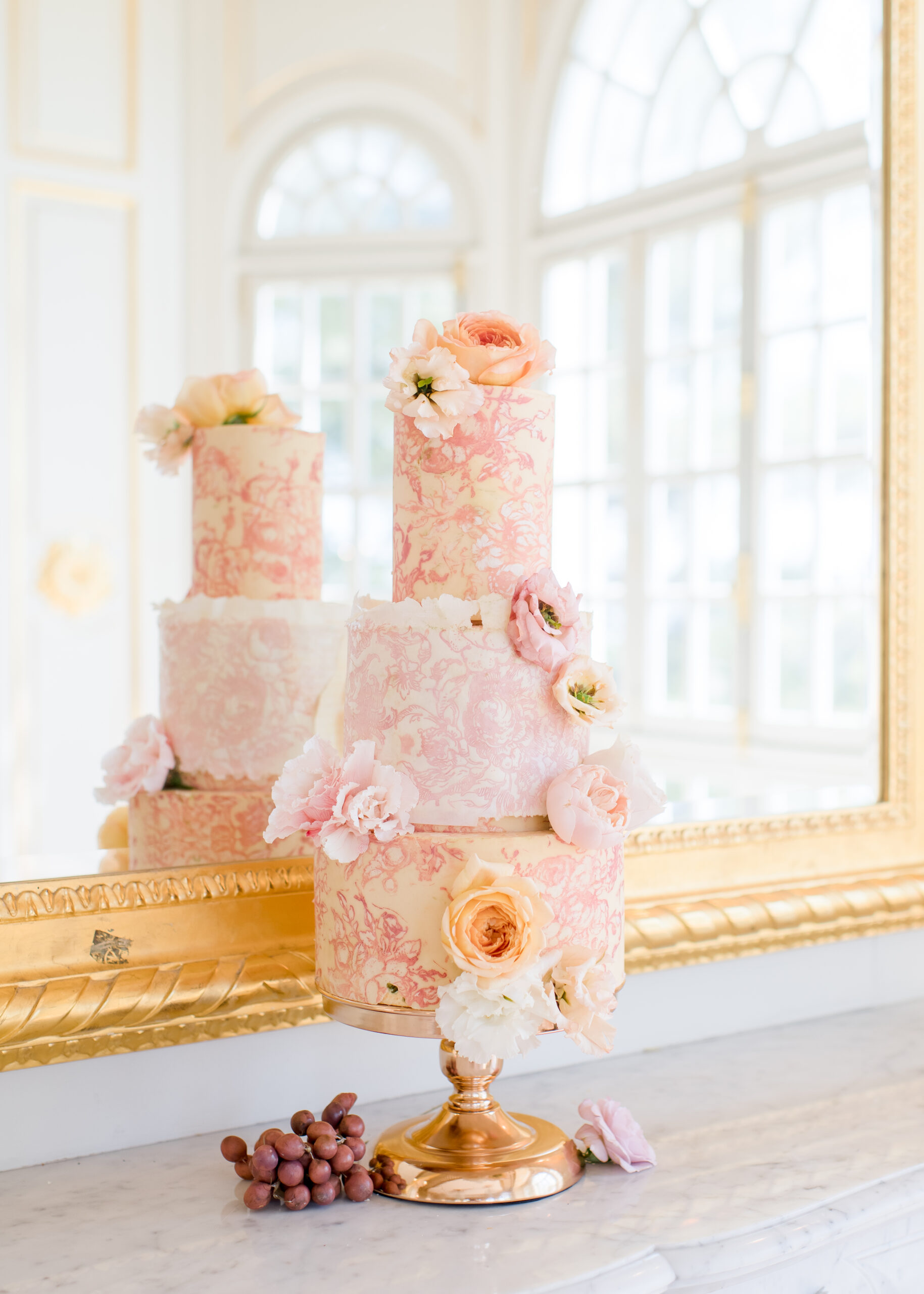 wedding cake in front of mirror