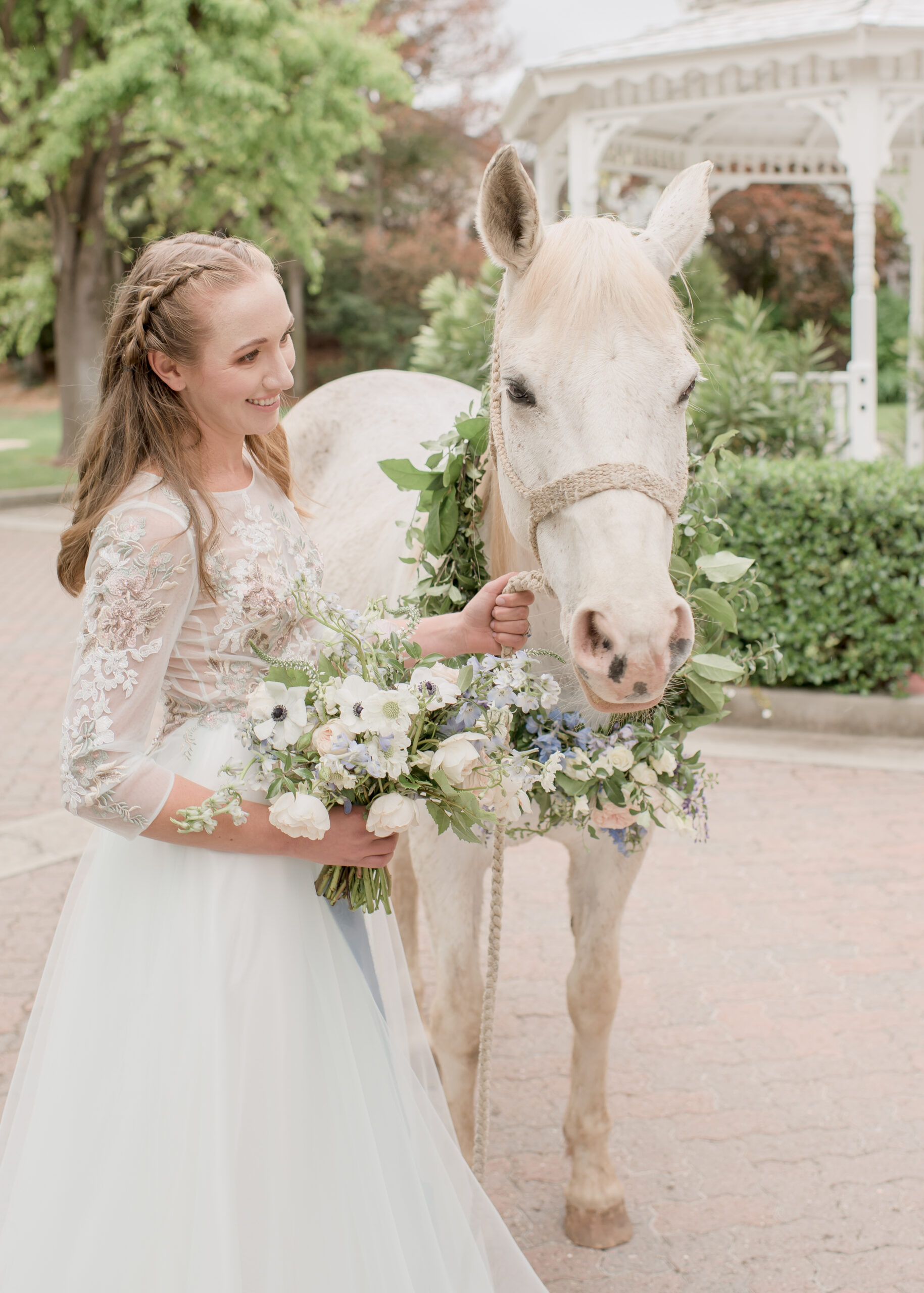 bride walking with white horse