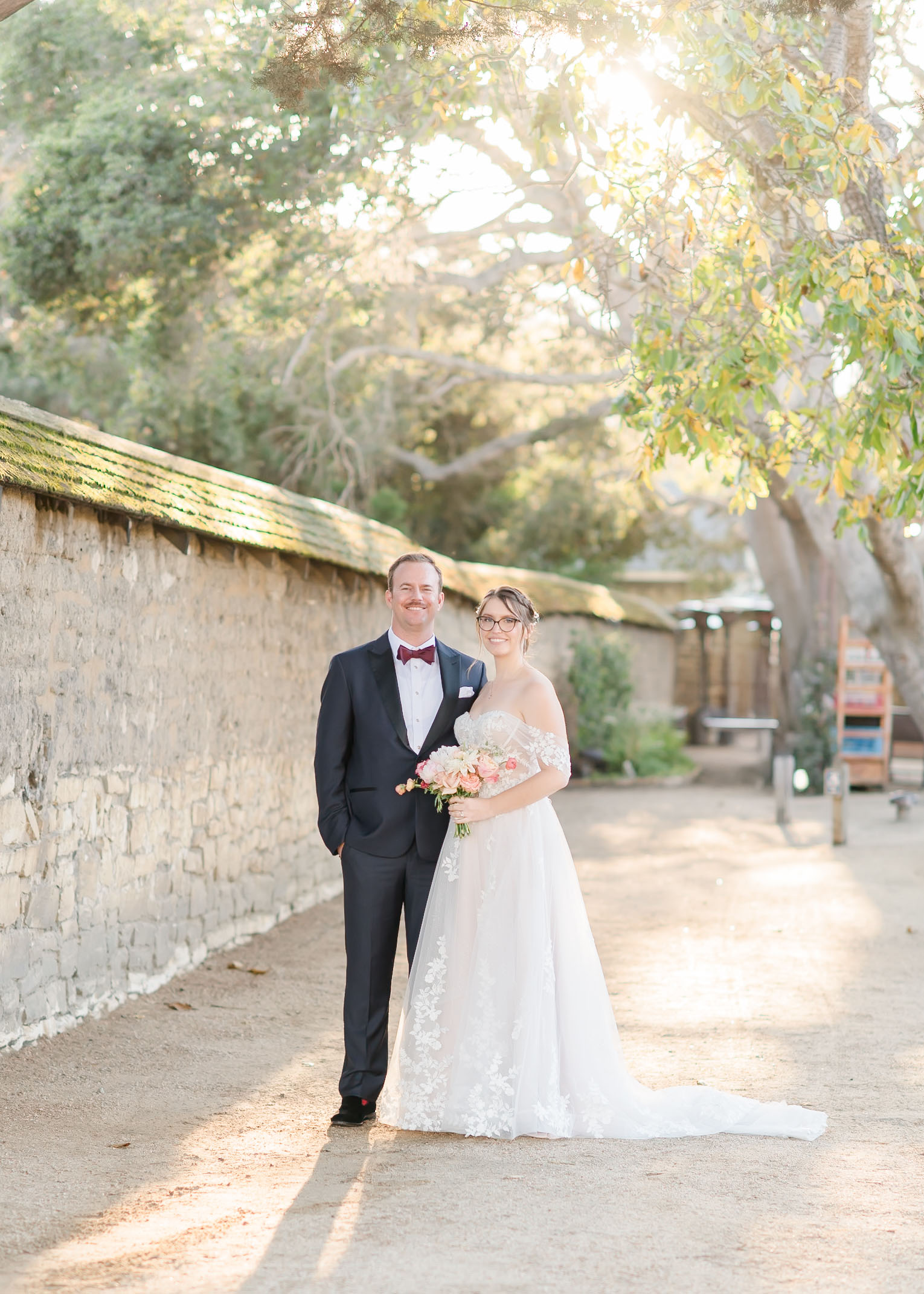 husband and wife facing camera and smiling