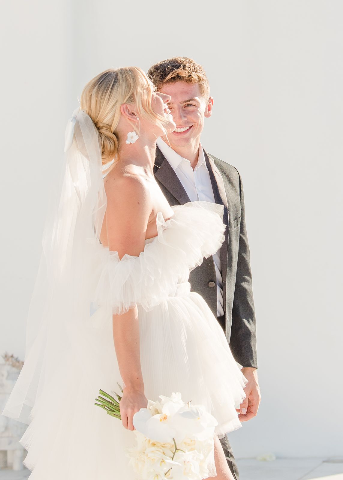 bride and groom walking next to each other at rocabella wedding