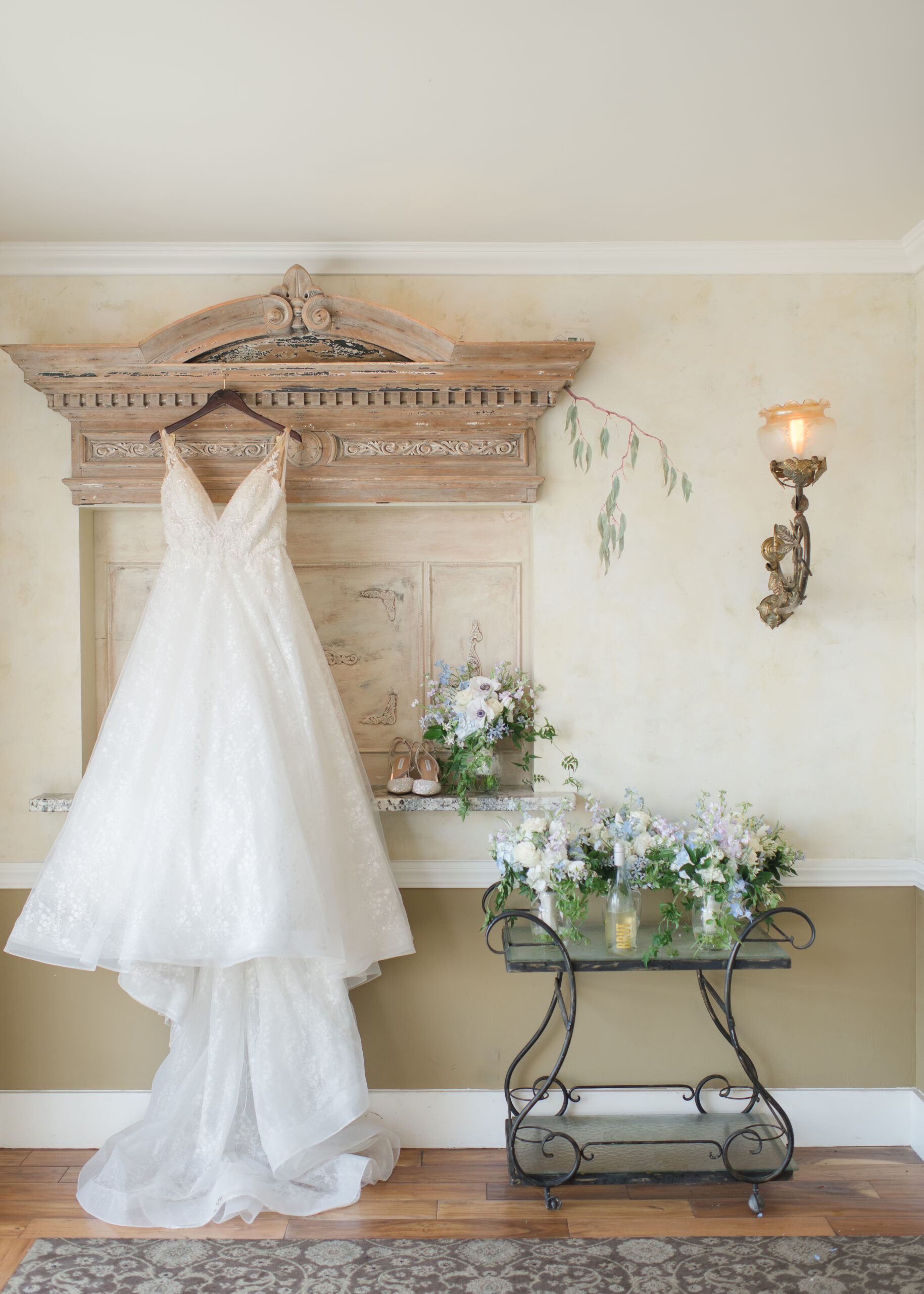 wedding dress hung on wall 