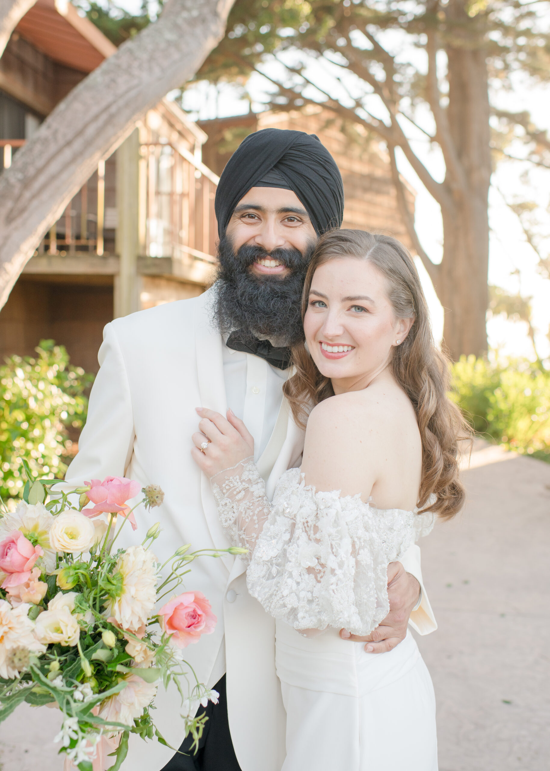 bride and groom looking at camera at their wedding