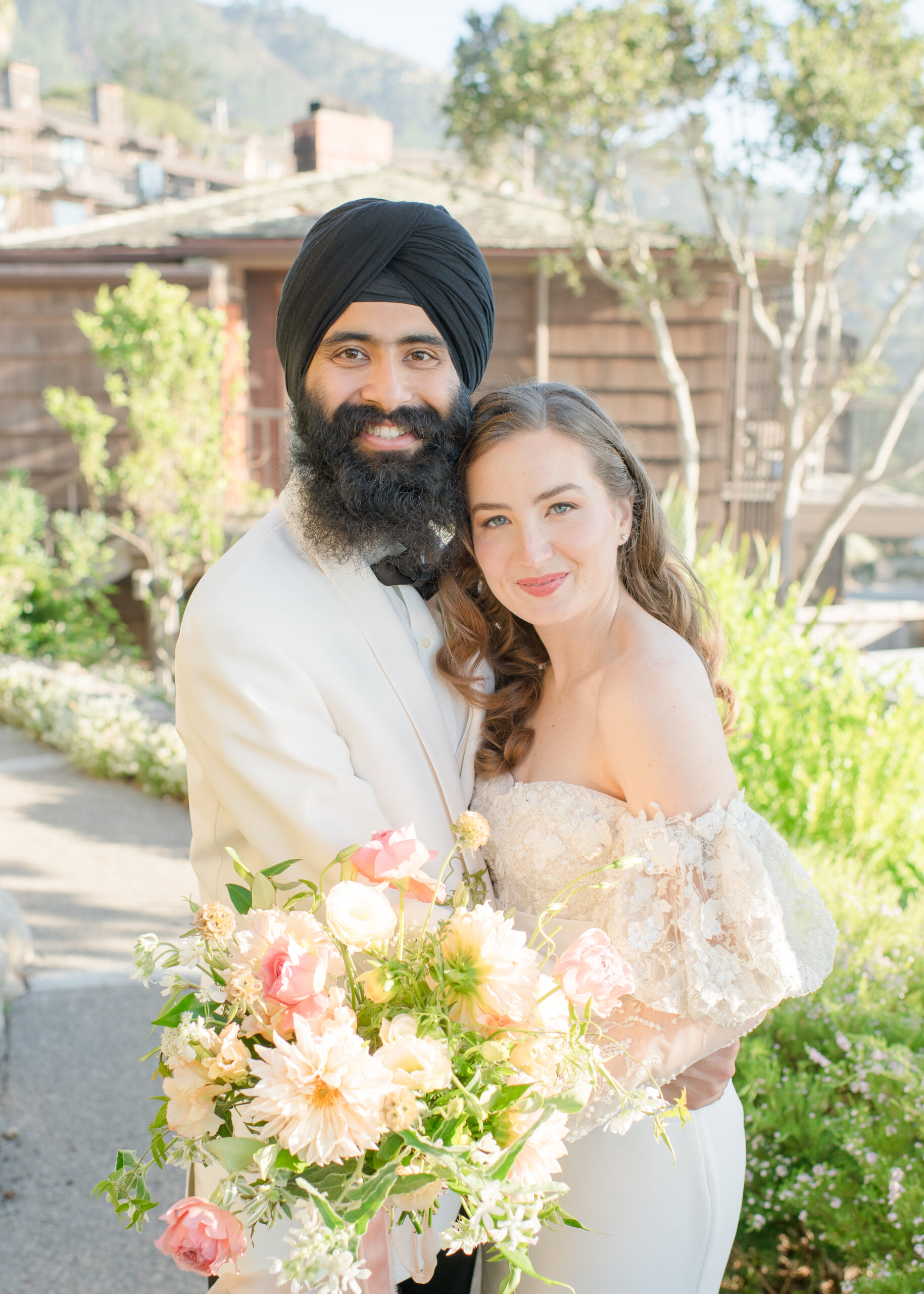 close up of wedding couple looking at camera and smiling