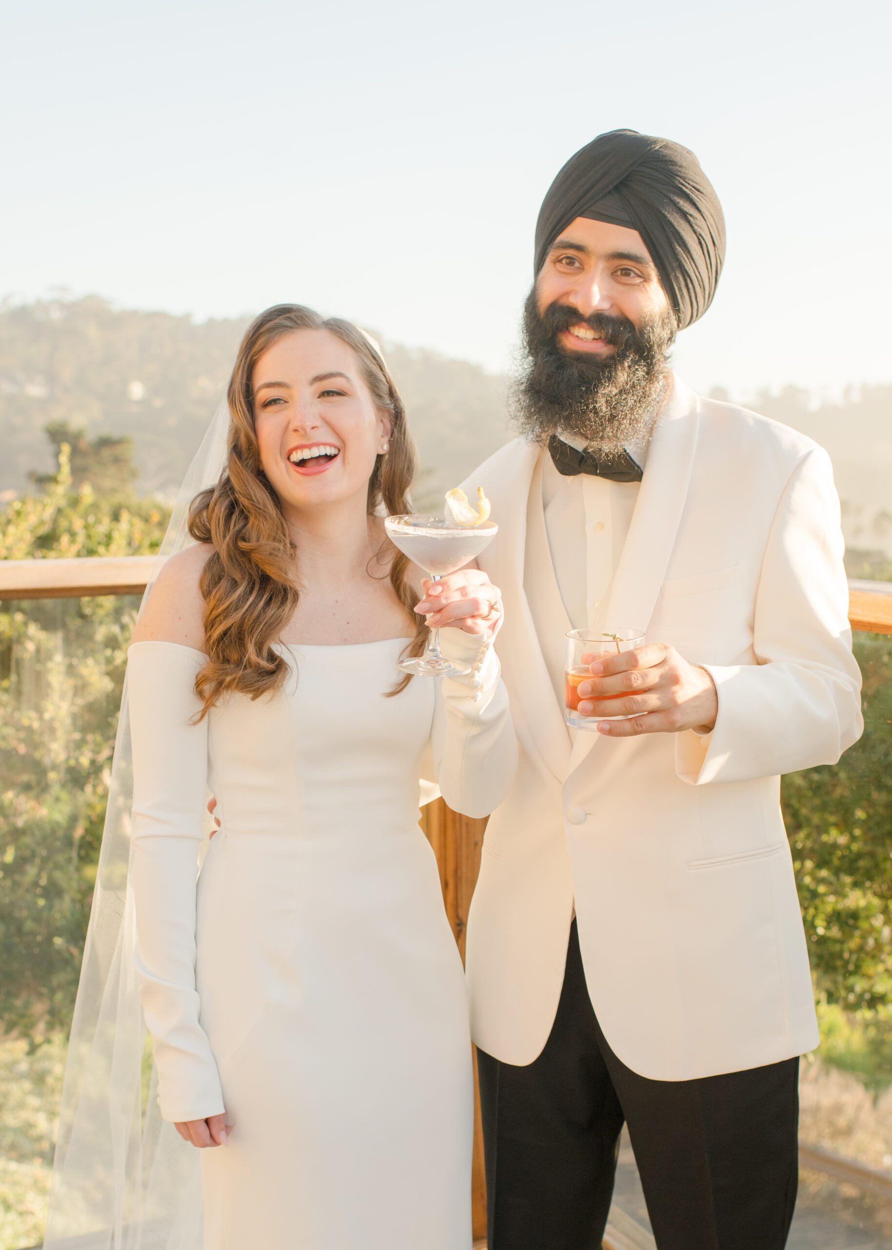 bride and groom holding drinks