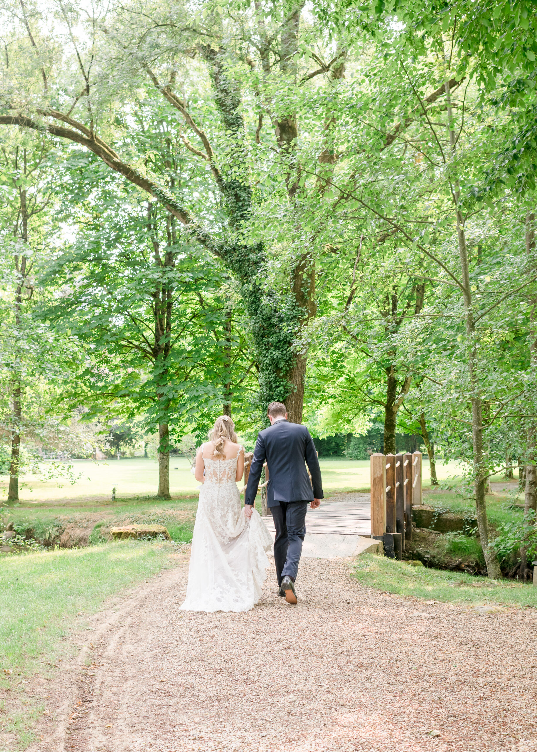 bride and groom walking away from camera