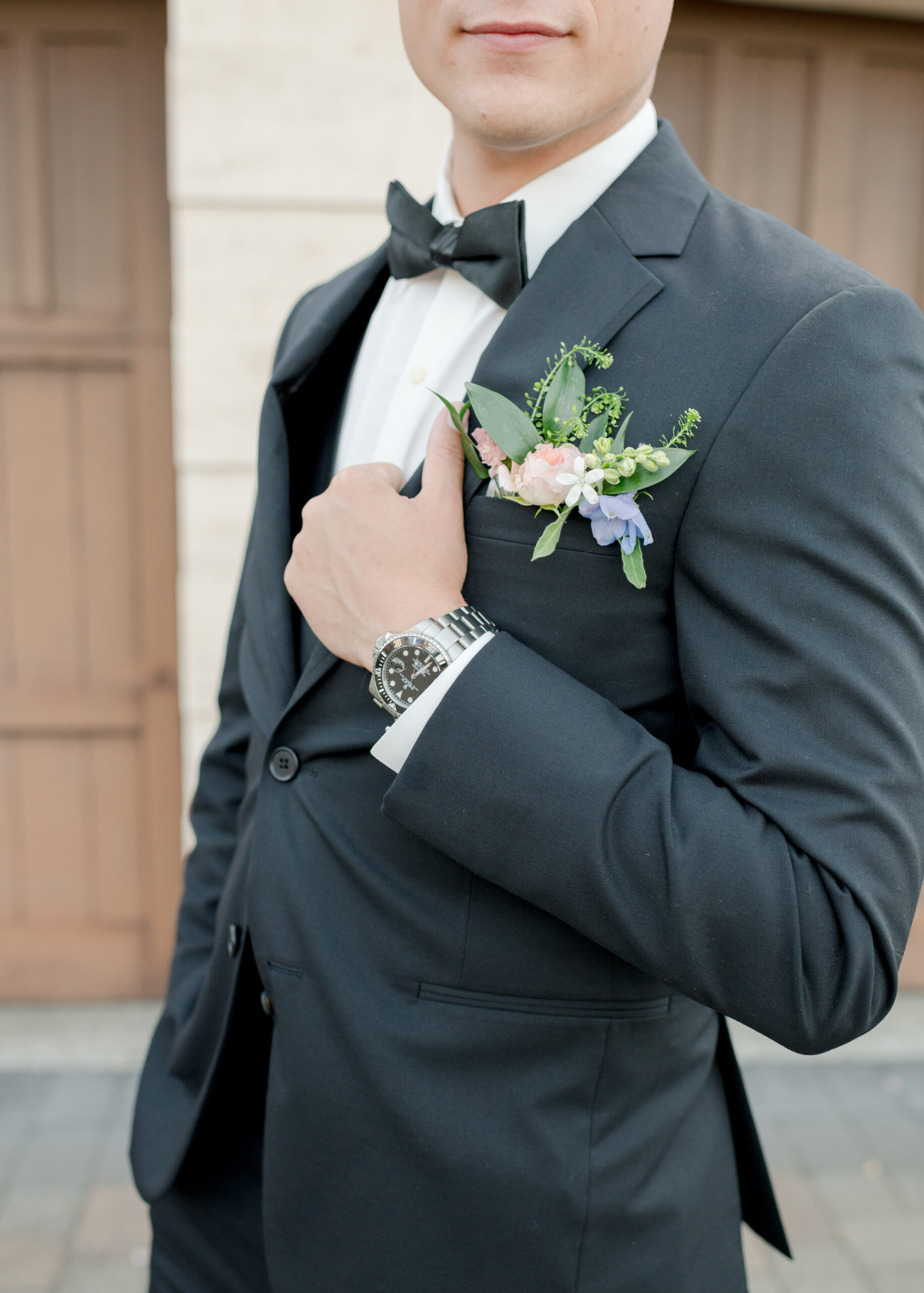 groom holding suit