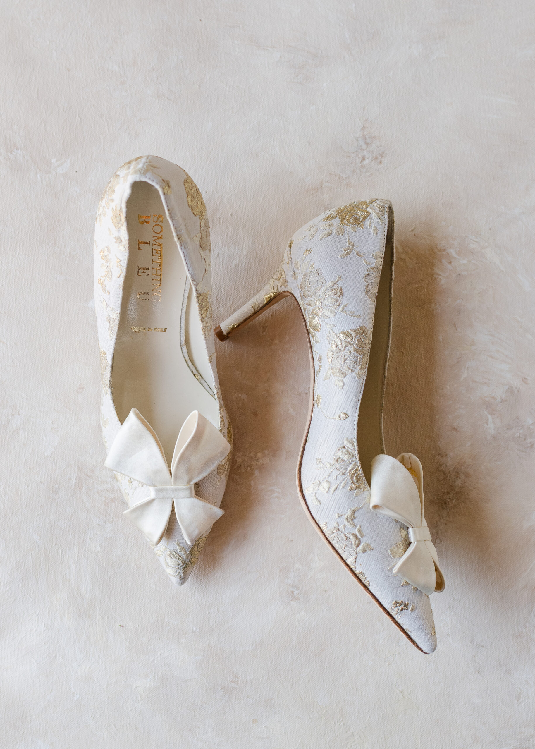gold and white wedding shoes