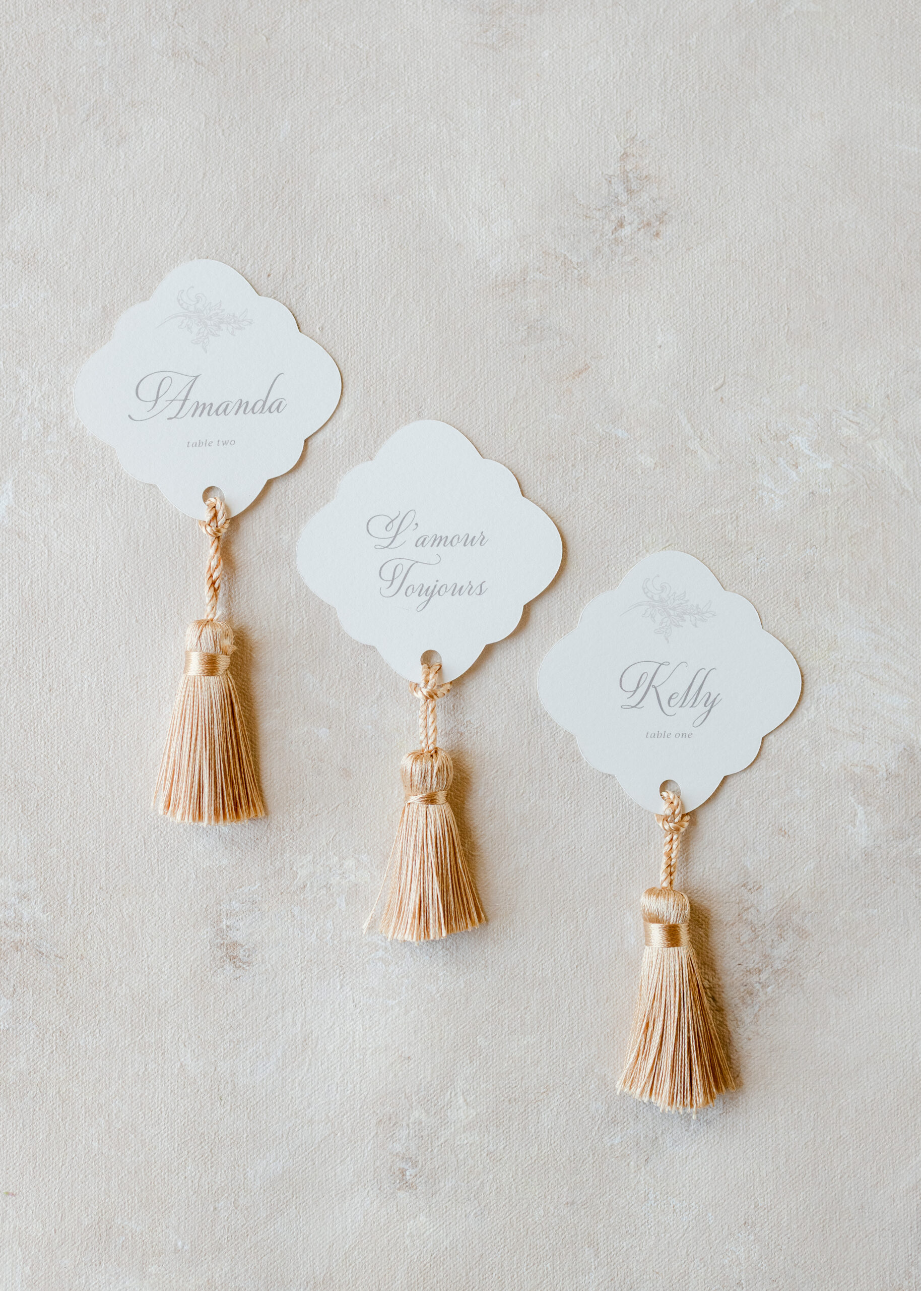 name tags with gold tossles