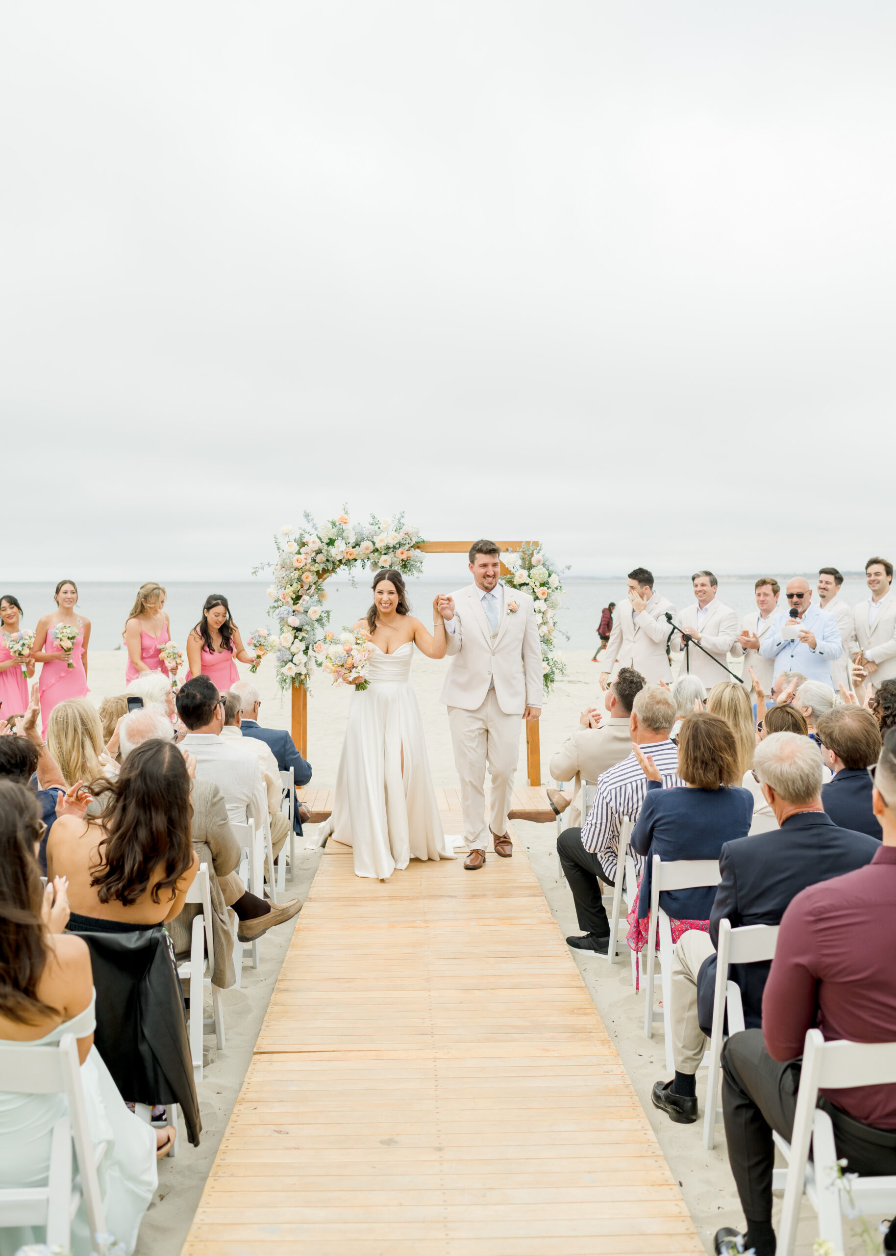 bride and groom walking down aisle.