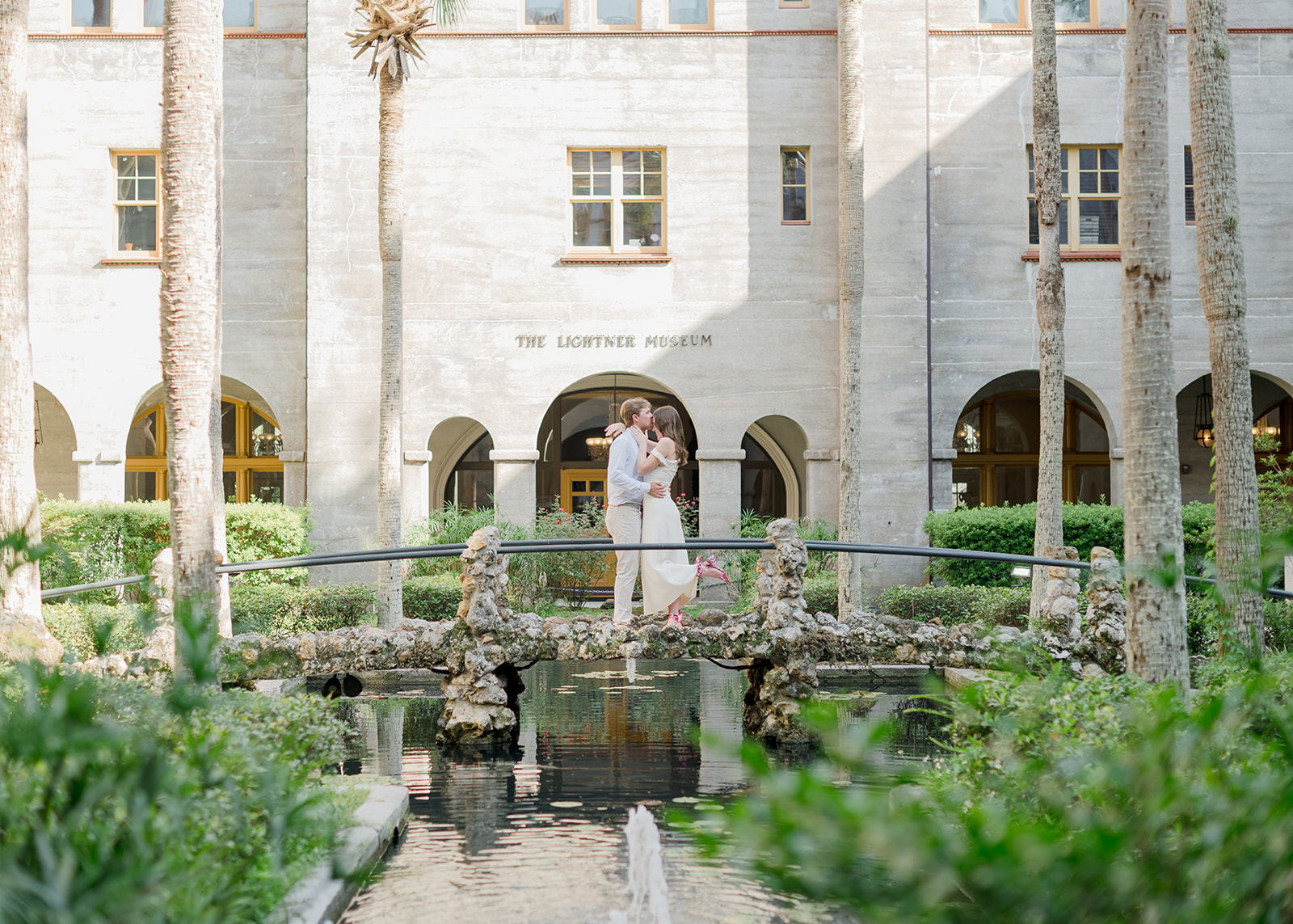 couple on bridge at the garden in Lightner Museum